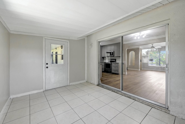 interior space featuring arched walkways and a ceiling fan