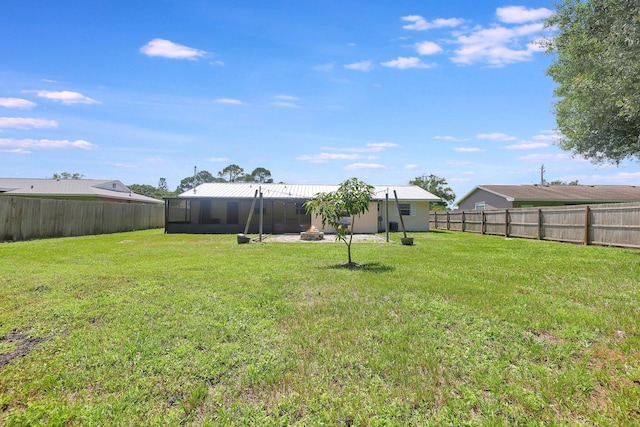 view of yard with a fenced backyard