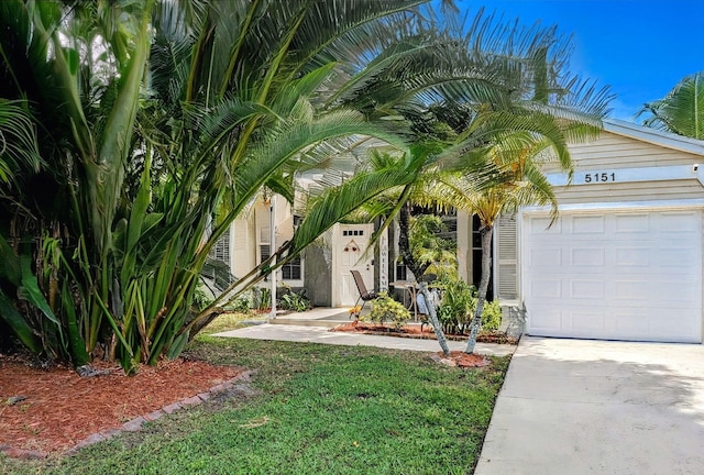 5151 Brian Blvd, Boynton Beach, FL 33472 - obstructed view of property with an attached garage and driveway