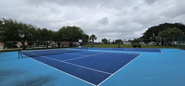 view of sport court with community basketball court and fence