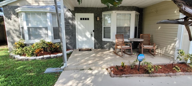 doorway to property featuring a porch