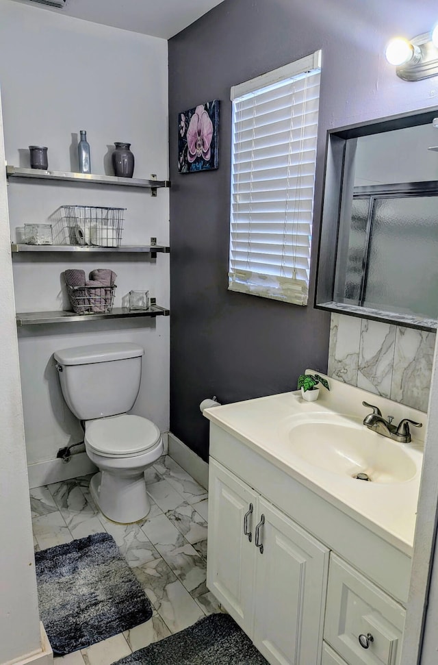 5151 Brian Blvd, Boynton Beach, FL 33472 - full bathroom featuring marble look tiles, vanity, and a shower stall
