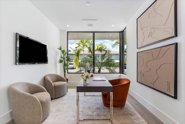 interior space featuring wood finished floors and baseboards