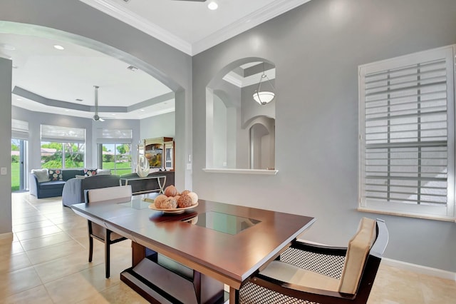 tiled dining room featuring crown molding, recessed lighting, a raised ceiling, a ceiling fan, and baseboards