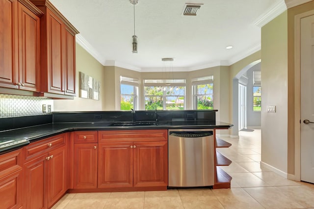 kitchen featuring visible vents, arched walkways, crown molding, stainless steel dishwasher, and a sink