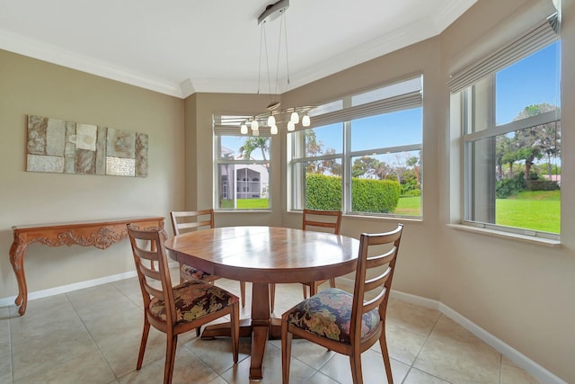 dining room featuring light tile patterned flooring, crown molding, and baseboards