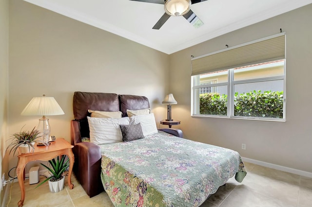 bedroom featuring ceiling fan, baseboards, crown molding, and tile patterned floors