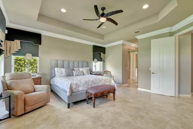 bedroom featuring visible vents, baseboards, a raised ceiling, and ornamental molding