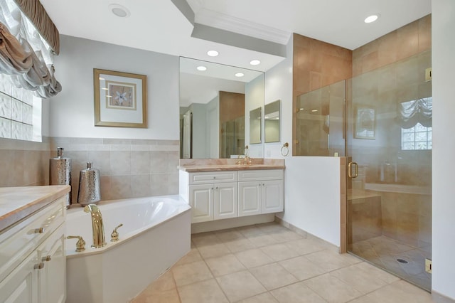 full bath with ornamental molding, tile patterned flooring, vanity, a shower stall, and a bath