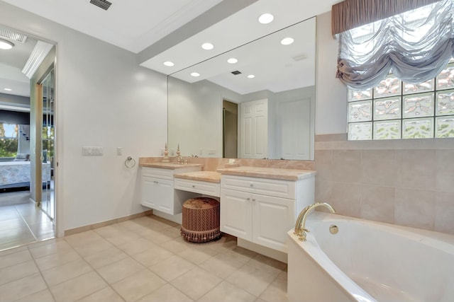 ensuite bathroom featuring tile patterned flooring, recessed lighting, a bath, double vanity, and ensuite bath