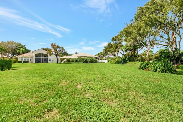 view of yard featuring a sunroom