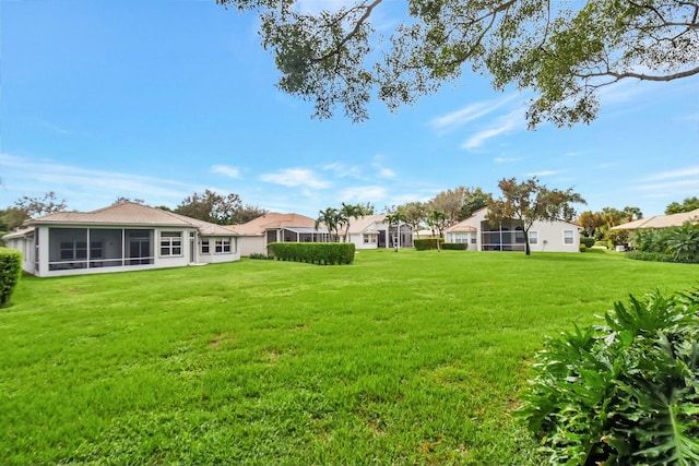 view of yard featuring a sunroom