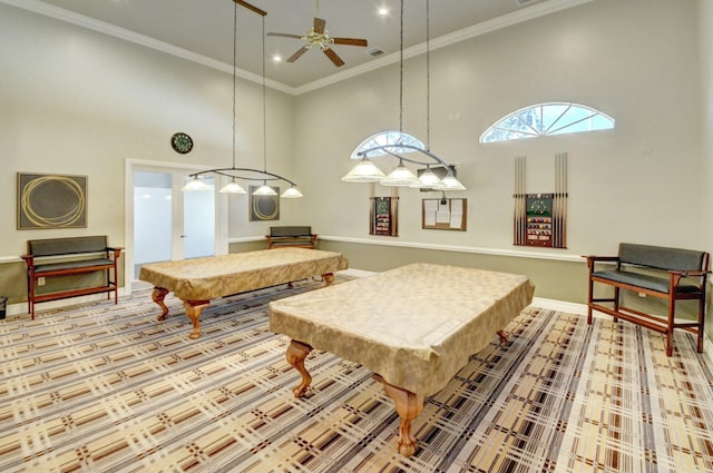 game room featuring crown molding, a towering ceiling, ceiling fan, billiards, and baseboards