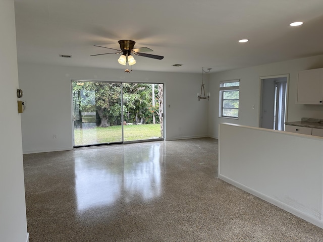 unfurnished room featuring baseboards, visible vents, light speckled floor, and recessed lighting