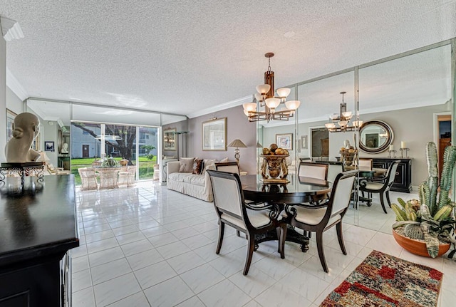 dining area featuring ornamental molding, a textured ceiling, an inviting chandelier, and light tile patterned floors