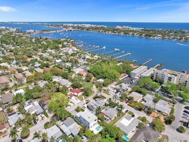 drone / aerial view featuring a water view and a residential view