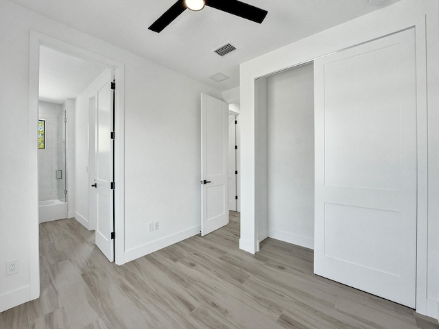 unfurnished bedroom featuring light wood finished floors, a ceiling fan, visible vents, and baseboards