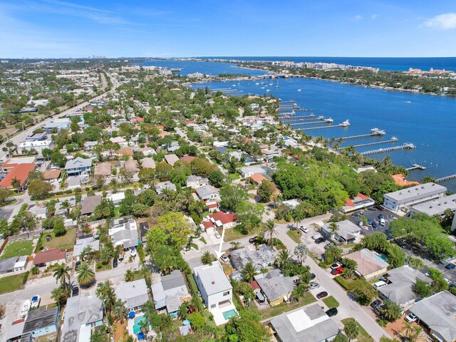 drone / aerial view with a water view and a residential view