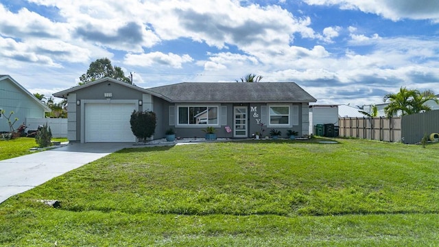 ranch-style home featuring driveway, an attached garage, fence, a front yard, and stucco siding