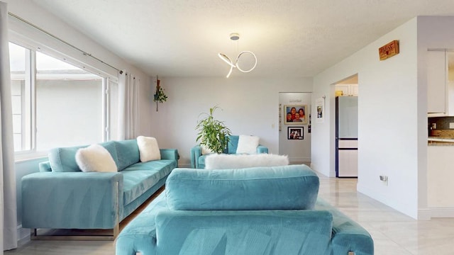 living area featuring baseboards