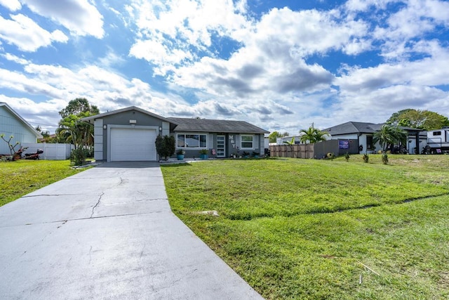 single story home featuring a front yard, fence, and an attached garage