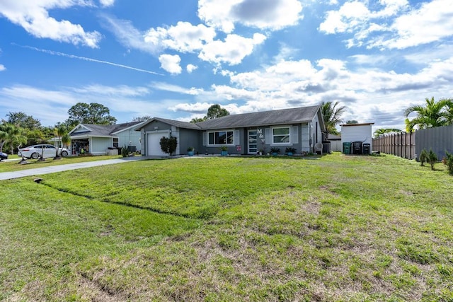 ranch-style house with a garage, driveway, a front yard, and fence