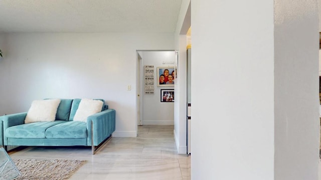 sitting room featuring baseboards