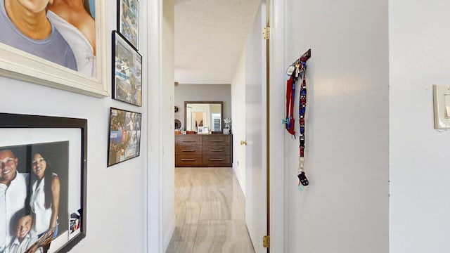 corridor featuring baseboards