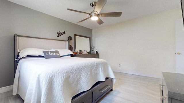 bedroom with a ceiling fan, light wood-style flooring, and baseboards