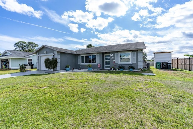 ranch-style home with a garage, a front yard, concrete driveway, and fence