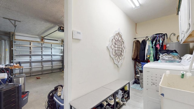 garage featuring a sink and washer and dryer