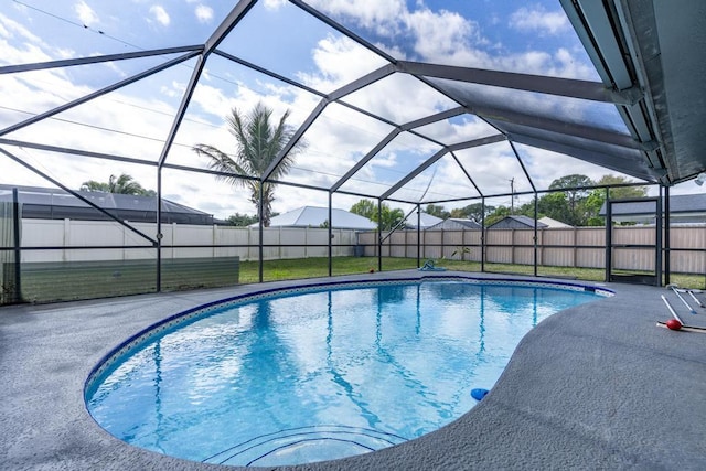 view of pool featuring a lanai, a fenced backyard, a fenced in pool, and a patio