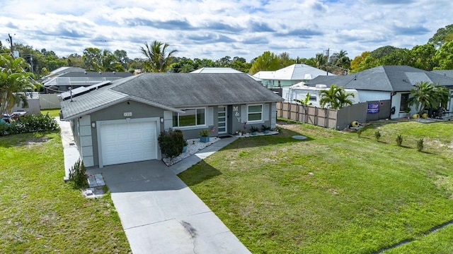 single story home with a front lawn, an attached garage, and fence