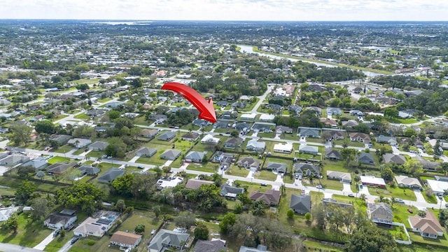 birds eye view of property with a residential view