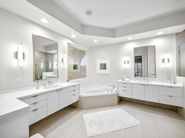 bathroom with two vanities, a sink, and a shower stall