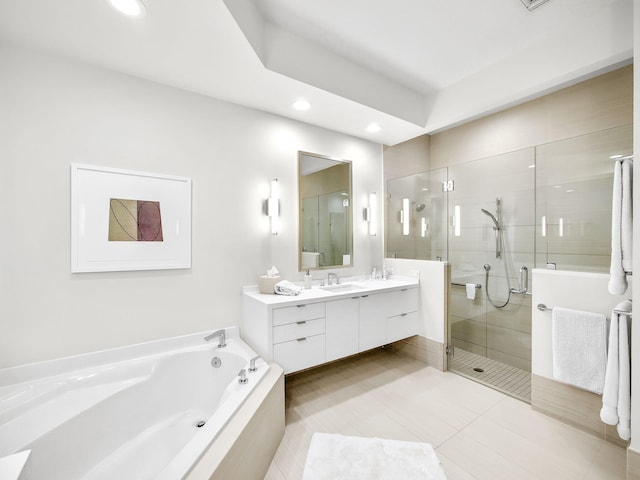 full bathroom featuring double vanity, a stall shower, a bath, tile patterned flooring, and a sink