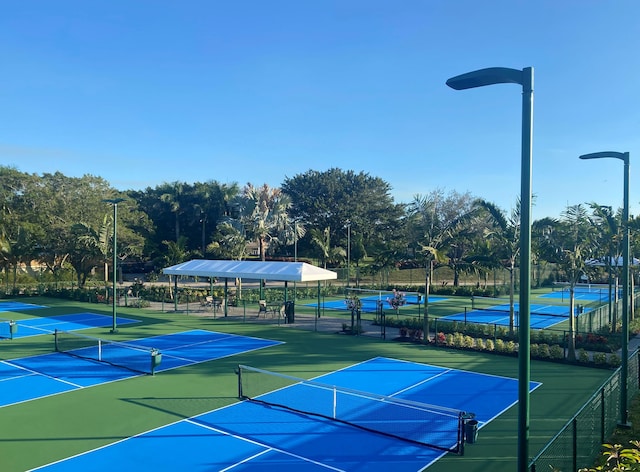 view of sport court with fence