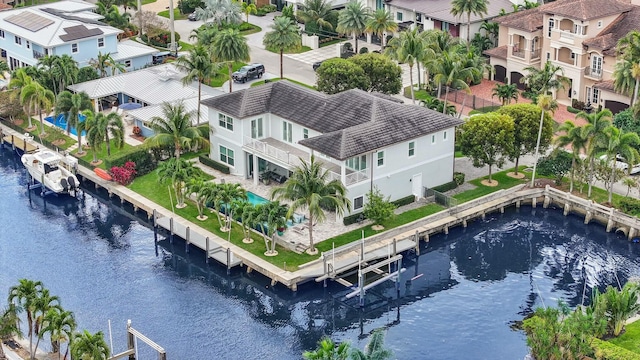 aerial view with a water view and a residential view