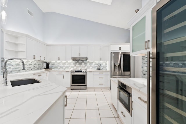 4214 SE Home Way, Port Saint Lucie, FL 34952 - kitchen featuring appliances with stainless steel finishes, tasteful backsplash, open shelves, a sink, and under cabinet range hood