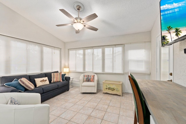 4214 SE Home Way, Port Saint Lucie, FL 34952 - living area with plenty of natural light, a ceiling fan, vaulted ceiling, and light tile patterned flooring