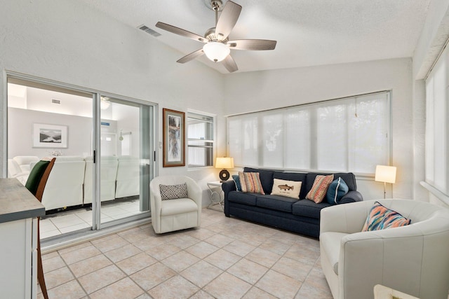 4214 SE Home Way, Port Saint Lucie, FL 34952 - living room with a ceiling fan, visible vents, light tile patterned floors, and lofted ceiling