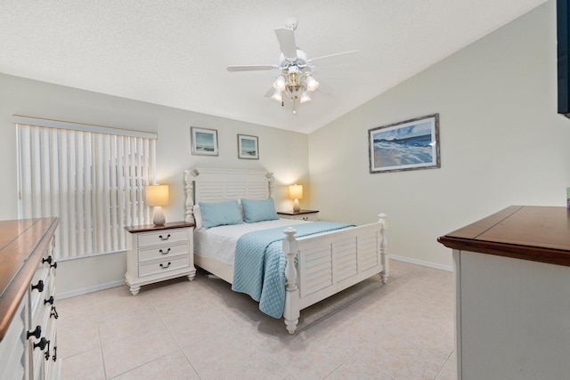 4214 SE Home Way, Port Saint Lucie, FL 34952 - bedroom with baseboards, a ceiling fan, vaulted ceiling, and light tile patterned flooring
