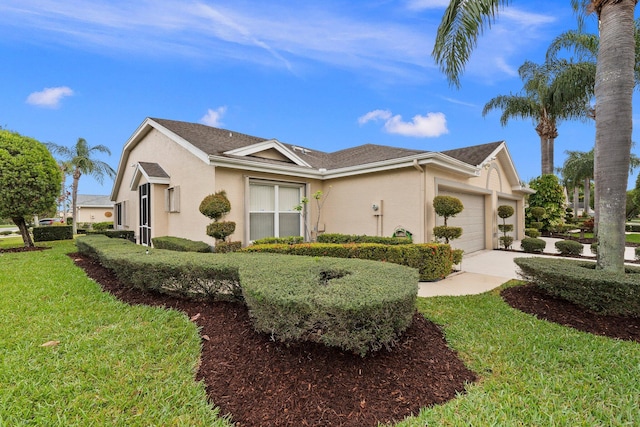 view of home's exterior with a yard, an attached garage, driveway, and stucco siding