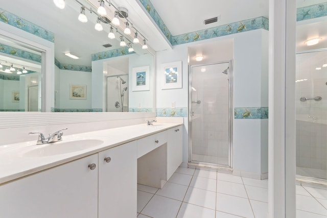 4214 SE Home Way, Port Saint Lucie, FL 34952 - full bathroom featuring a sink, double vanity, tile patterned floors, a shower stall, and visible vents