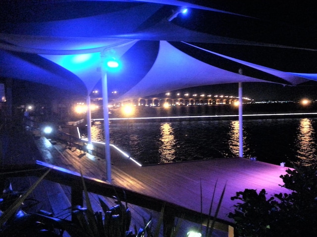 4214 SE Home Way, Port Saint Lucie, FL 34952 - yard at twilight featuring a boat dock and a water view