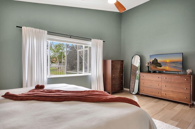 bedroom with ceiling fan and light wood finished floors