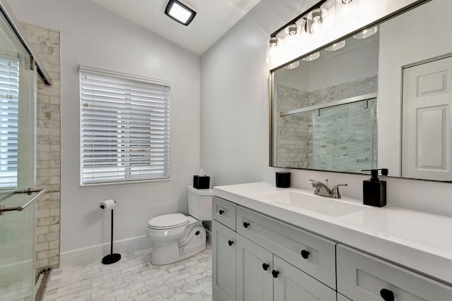 bathroom with lofted ceiling, toilet, vanity, baseboards, and a shower stall