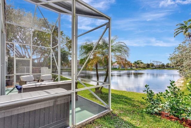 unfurnished sunroom featuring a water view