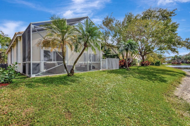 view of yard with glass enclosure