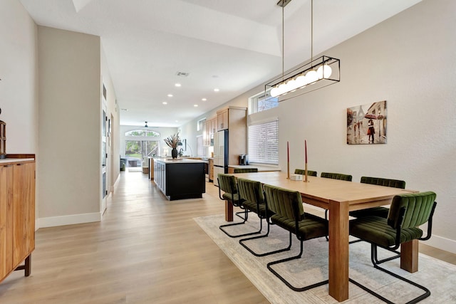 dining room with light wood-type flooring, visible vents, baseboards, and recessed lighting